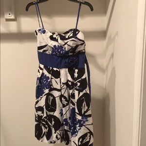 white dress with blue and black floral design